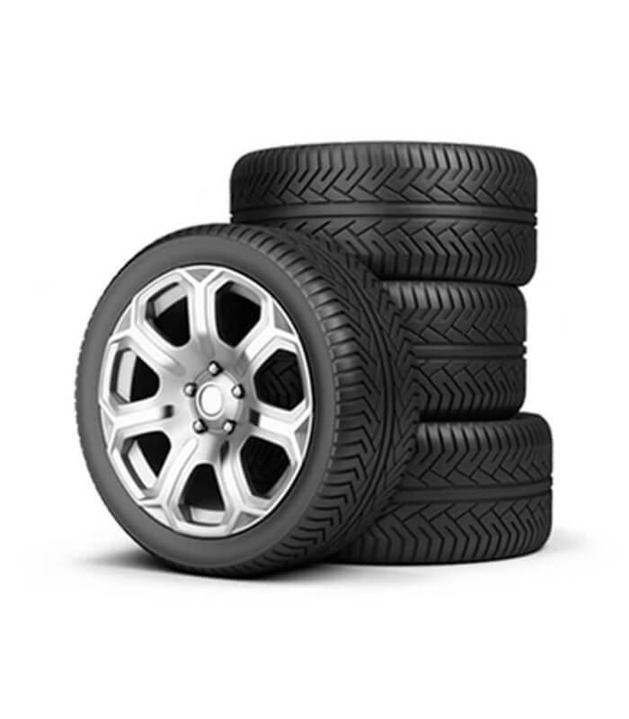 car tires, with one tire mounted on a wheel rim and a stack of three other tires.